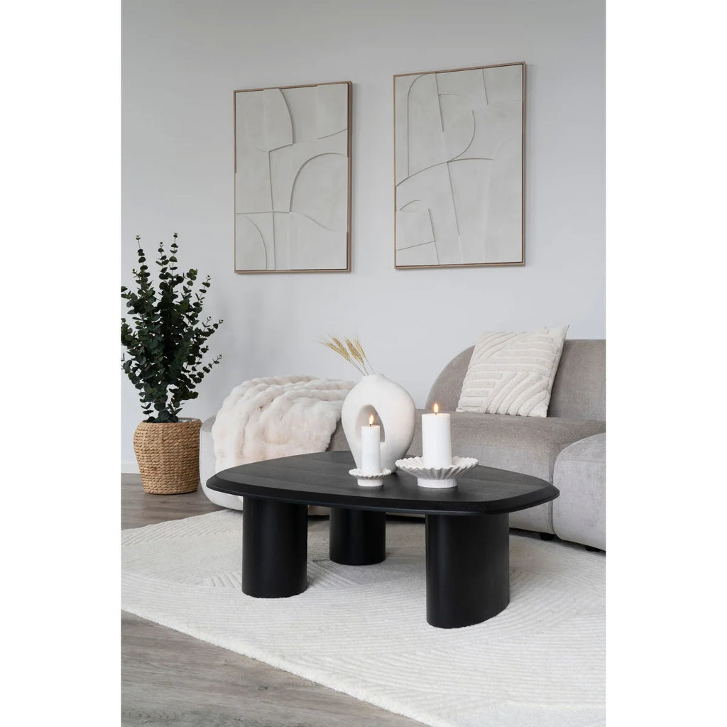 Table basse ovale noire aux pieds cylindriques épais