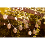 Guirlande lumineuse en rotin naturel avec lanternes ovales ajourées