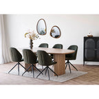 Table ovale moderne bois clair piétement central avec 6 chaises vertes