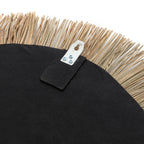 Face arrière d’un miroir rond en herbe et coton noir avec support métallique artisanat