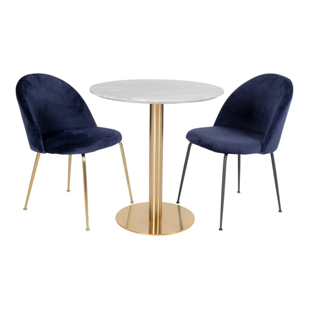 Chaises velours bleu marine pieds métal doré et noir près table ronde marbre blanc Ø70 cm
