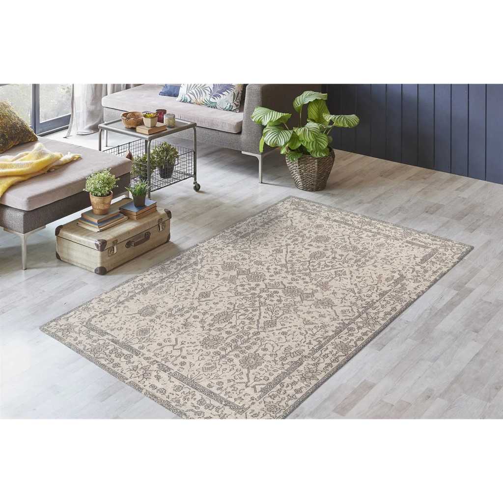 Tapis oriental rectangulaire en coton beige avec motif patiné et border intricate