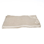 Torchon en lin naturel beige avec motif poisson et bulles brodé blanc